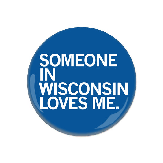 Blue RAYGUN circular pinback button with the white text SOMEONE IN WISCONSIN LOVES ME.