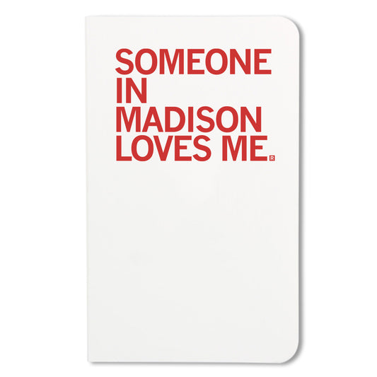 A white RAYGUN notebook cover with the red text SOMEONE IN MADISON LOVES ME.