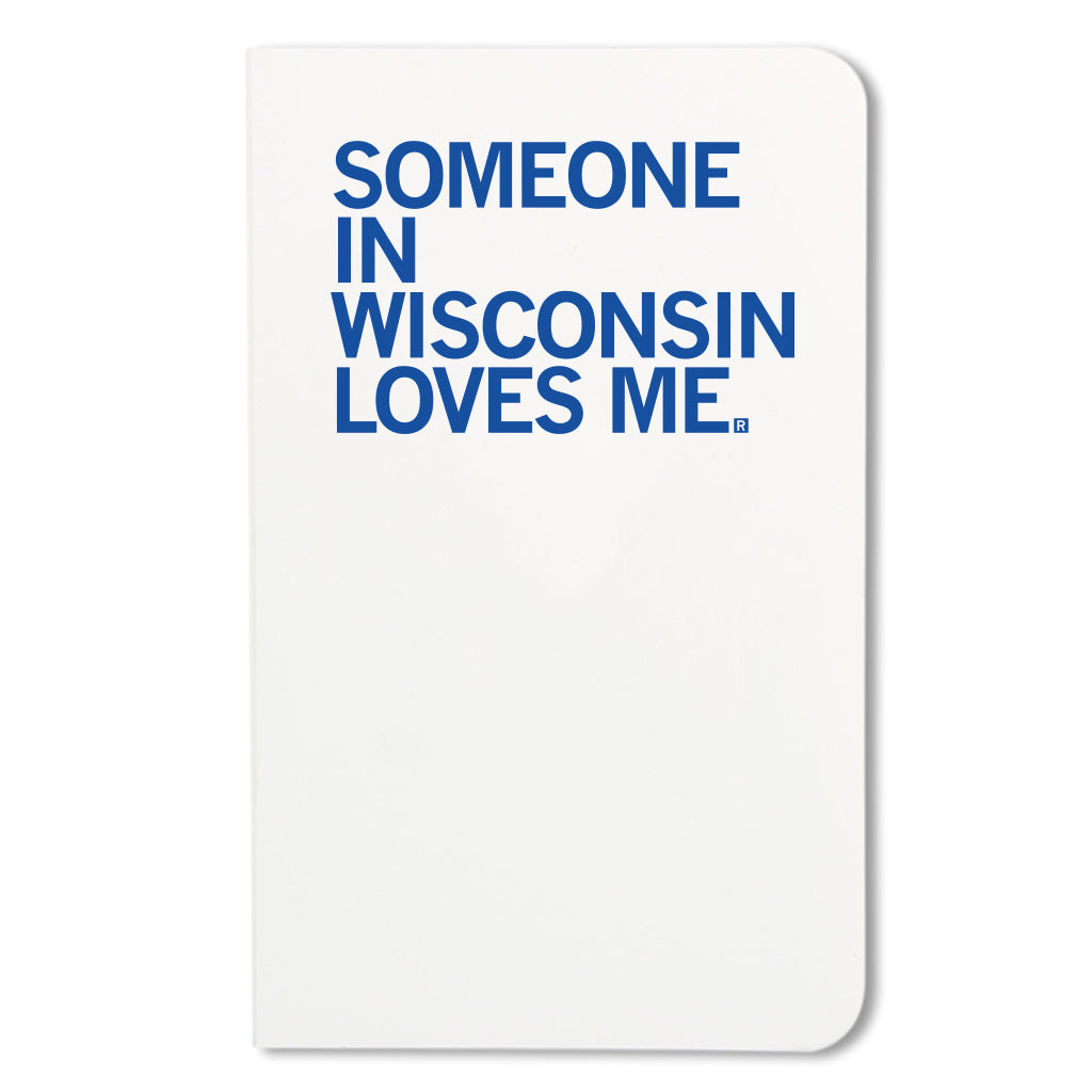 White RAYGUN notebook with the blue text SOMEONE IN WISCONSIN LOVES ME. printed on the cover.