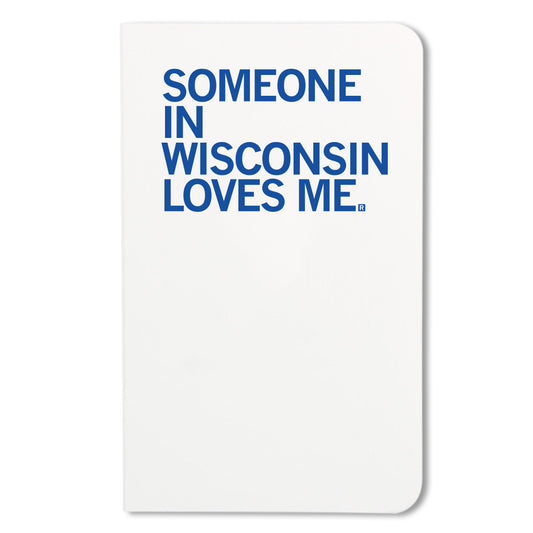 White RAYGUN notebook with the blue text SOMEONE IN WISCONSIN LOVES ME. printed on the cover.