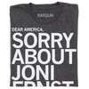 Dark gray union-made t-shirt with white text that reads: DEAR AMERICA, SORRY ABOUT JONI ERNST.