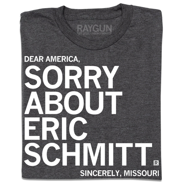 A folded heather charcoal t-shirt with white ink print that reads 