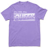 A garment-dyed, purple crew-neck t-shirt featuring a white checkerboard graphic with the text STILL HERE, STILL QUEER in a bold, stylized font.