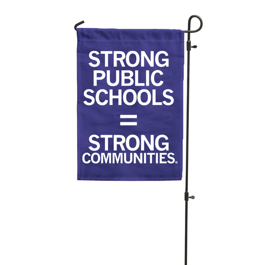 A purple polyester garden flag on a metal stand that reads, STRONG PUBLIC SCHOOLS = STRONG COMMUNITIES.
