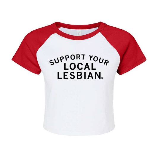 White raglan baby tee with red sleeves and the text SUPPORT YOUR LOCAL LESBIAN. printed in black on the front.