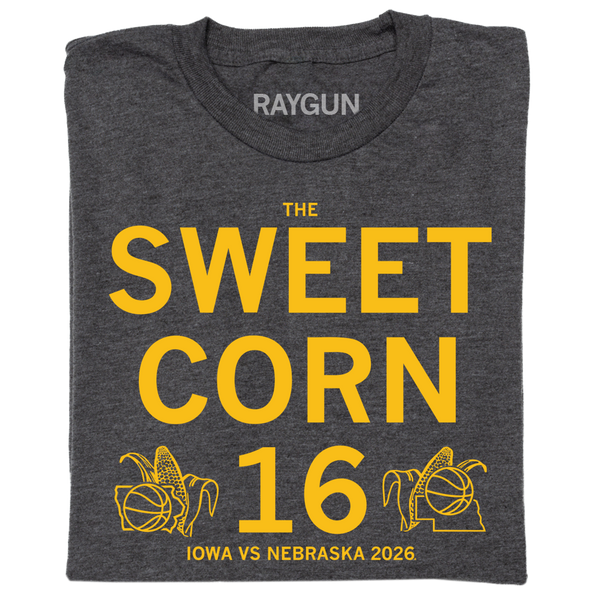 A folded charcoal t-shirt with centered gold ink text that reads 