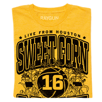 A folded mellow yellow t-shirt with black ink text that reads "Live from Houston: The Sweet Corn 16. IA vs NE. Iowa, Nebraska 2026." In the center of the shirt is a basketball with the number 16 on it, Iowa to the left, Nebraska to the right, and corn growing behind it.