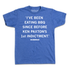 Heather royal blue t-shirt with white ink print that reads ""I've been eating BBQ since before Ken Paxton's 1st indictment." - James Talarico"
