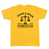 A heather gold shirt with black ink text that reads "Taylor & Taylor: Attorneys At Law" with in image of a scale that has a basketball on either side