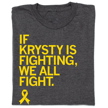 Charcoal gray union labor t-shirt with yellow text that reads, IF KRYSTY IS FIGHTING, WE ALL FIGHT, above a yellow osteosarcoma awareness ribbon.