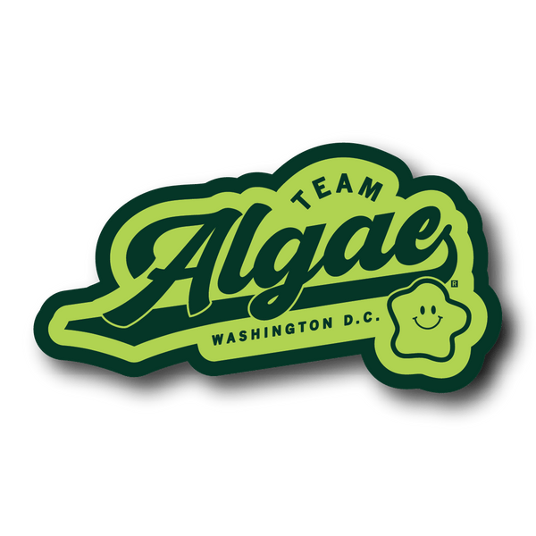 A lime green die-cut sticker with forest green outline and text that says, 
