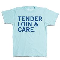 Short sleeve light blue t-shirt with left-aligned royal blue print that reads "Tender Loin & Care"