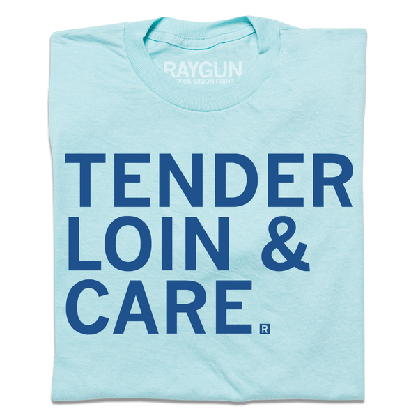A folded pastel blue shirt with royal blue text that says, 