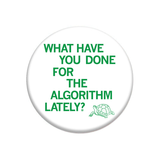Circular RAYGUN button featuring green text that reads WHAT HAVE YOU DONE FOR THE ALGORITHM LATELY? next to a small line drawing of a turtle.