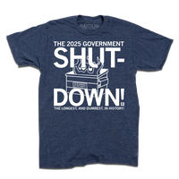 A Heather navy shirt with text in white ink that reads "The 2025 Government Shutdown: the longest and dumbest in history." over an illustration of a dumpster on fire.