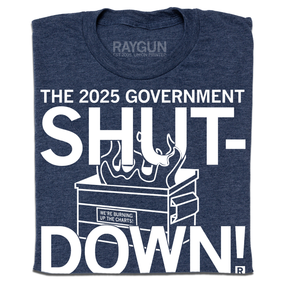 Heather navy t-shirt with text in white ink that reads "The 2025 Government Shutdown: the longest and dumbest in history." over an illustration of a dumpster on fire.