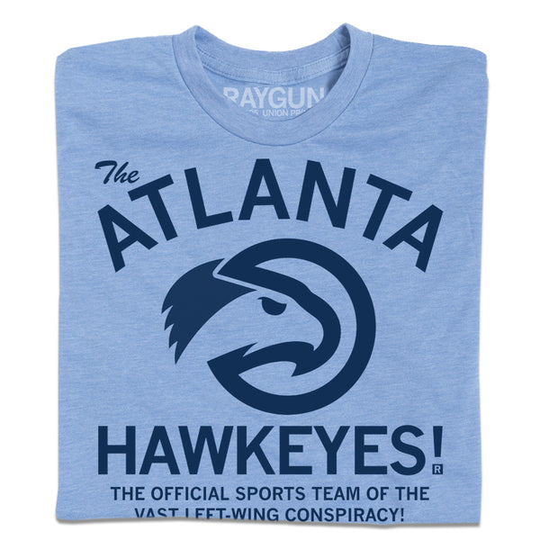 Folded heather light blue t-shirt with navy ink that reads 