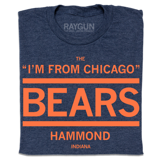 Folded heather navy t-shirt with orange ink print that says, "The I'm From Chicago Bears. Hammond Indiana"