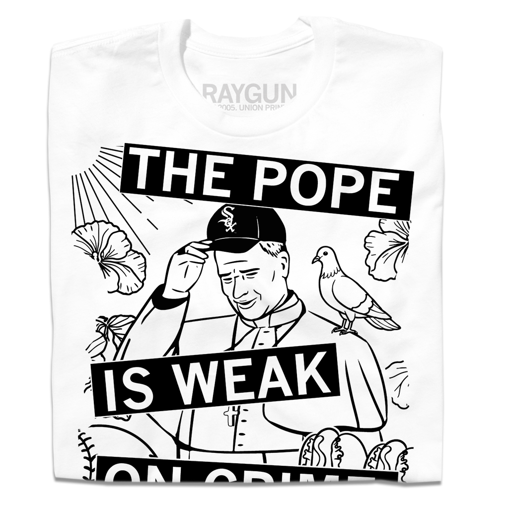 White RAYGUN t-shirt featuring a black and white graphic of the Pope wearing a Chicago White Sox cap with a pigeon on his shoulder and the text THE POPE IS WEAK ON CRIME.