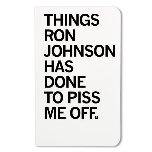 A small RAYGUN notebook with the text THINGS RON JOHNSON HAS DONE TO PISS ME OFF printed on the cover.