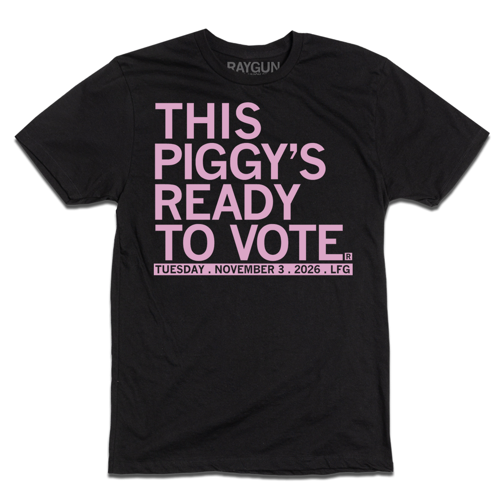 Black t-shirt with light pink ink that says, "This piggy's ready to vote. Tuesday, November 3rd 2026. LFG!"