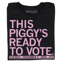 Folded black t-shirt with light pink ink that says, "This piggy's ready to vote. Tuesday, November 3rd 2026. LFG!"