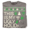 A grey RAYGUN crew sweatshirt featuring the text THIS IS MY UGLY HOLIDA in pixelated letters, surrounded by green and white icons of menorahs, dreidels, trees, and gift boxes.