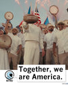 A person holds up a football labeled Together, we are America in front of a celebratory crowd holding tambourines, printed on a garment-dyed heavyweight t-shirt with the text Together, we are America. at the bottom.