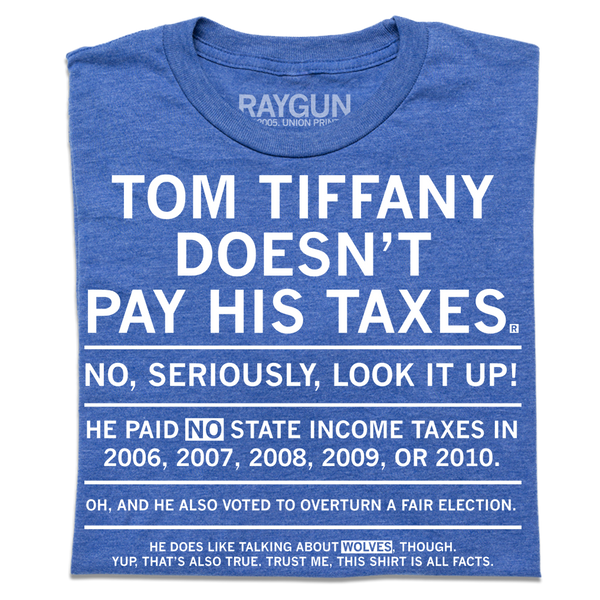 A folded heather royal blue t-shirt with centered white ink text that gets smaller every sentence. It says, 