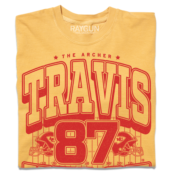 Gold shirt with bright red ink that reads 