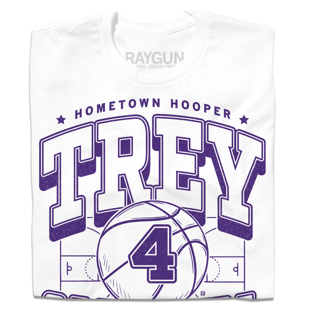 A folded white t-shirt with purple ink that reads "Hometown Hooper. Trey Campbell. Guard. Cedar Falls" over an illustration of a basketball court with a giant basketball in the center that has the number 4 on it.