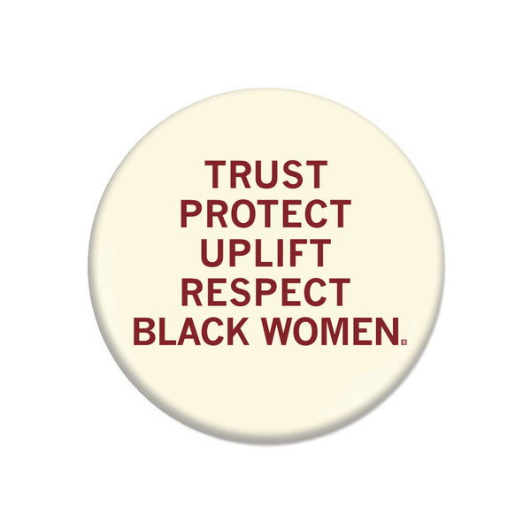 An off-white button with centered cardinal ink that says, 