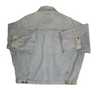 Back view of a vintage, light-wash denim jacket with long sleeves and metal button closures at the cuffs and hem.