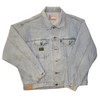 Vintage, light-wash denim jacket with brass buttons and two chest pockets, featuring a Liberto brand patch on the front.