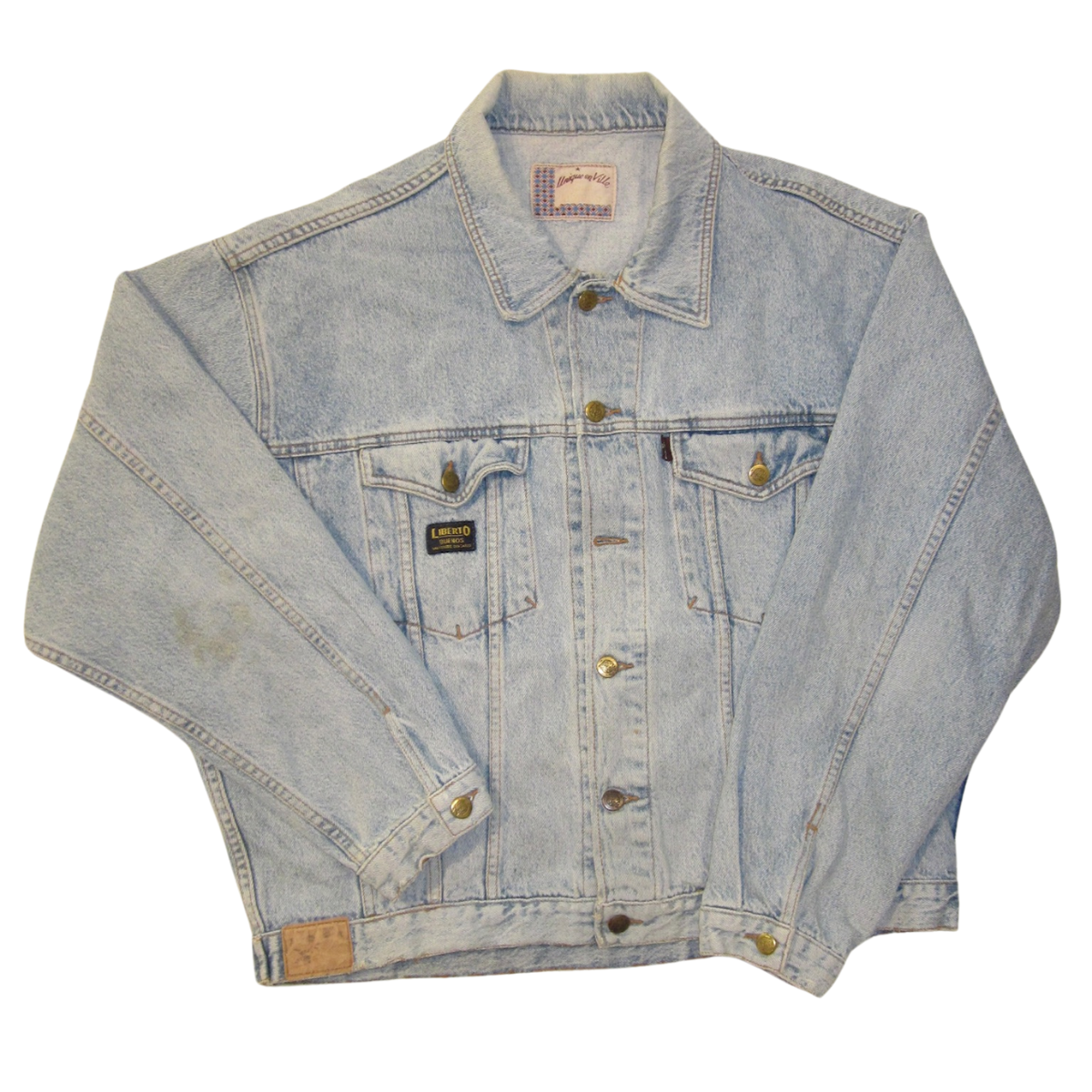 Vintage, light-wash denim jacket with brass buttons and two chest pockets, featuring a Liberto brand patch on the front.