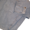 Vintage denim jacket sleeve in a light wash with a buttoned cuff.