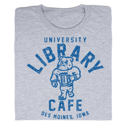 Grey RAYGUN t-shirt with a blue graphic of a bulldog holding a book, reading University Library Cafe, Des Moines, Iowa.