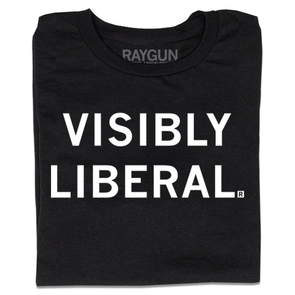 A folded black shirt with centered white ink text that reads "Visibly Liberal"