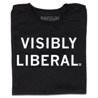 A folded black shirt with centered white ink text that reads "Visibly Liberal"