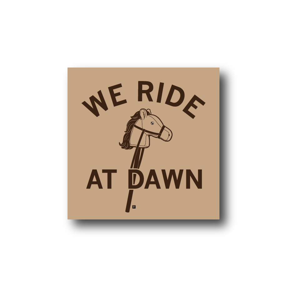 Vinyl sticker featuring an illustration of a hobby horse with the text WE RIDE AT DAWN.