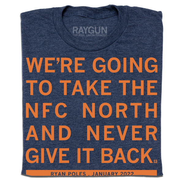 a folded heather navy t-shirt with orange ink text that reads 