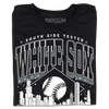 A folded black t-shirt with white ink. Text reads "South Side tested. White Sox Chicago. Pope approved." with the Chicago skyline in the center and a baseball above it.