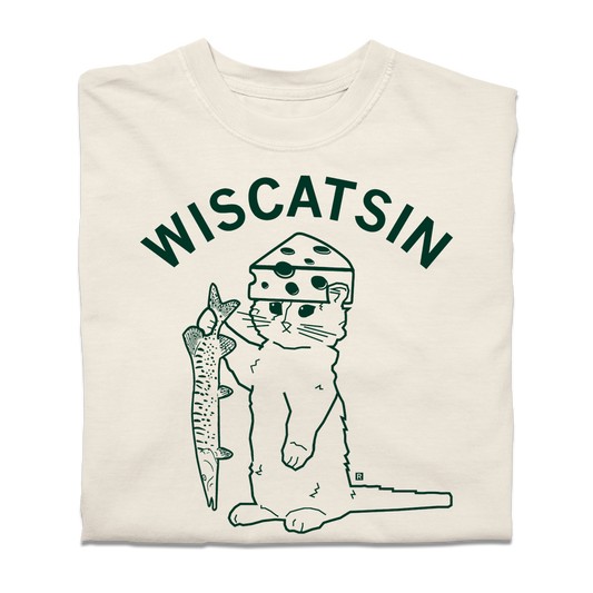 A folded ivory heavyweight t-shirt with dark green ink. Curved text near the top says, "Wiscatsin" above an illustration of RAYGUN's cat mascot, Gary, wearing a cheese hat and holding a fist.