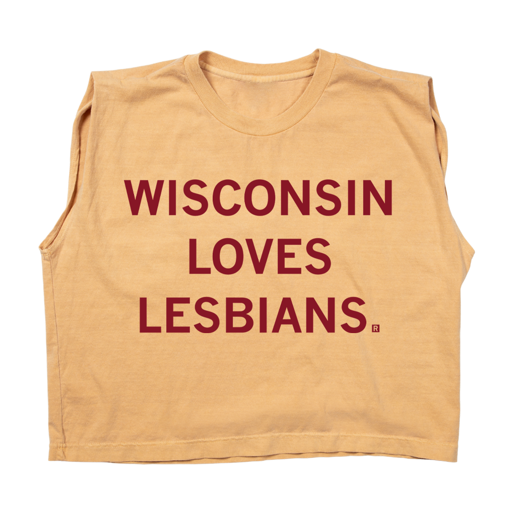 A heavyweight sleeveless gold crop top with cardinal ink that says, "Wisconsin Loves Lesbians."