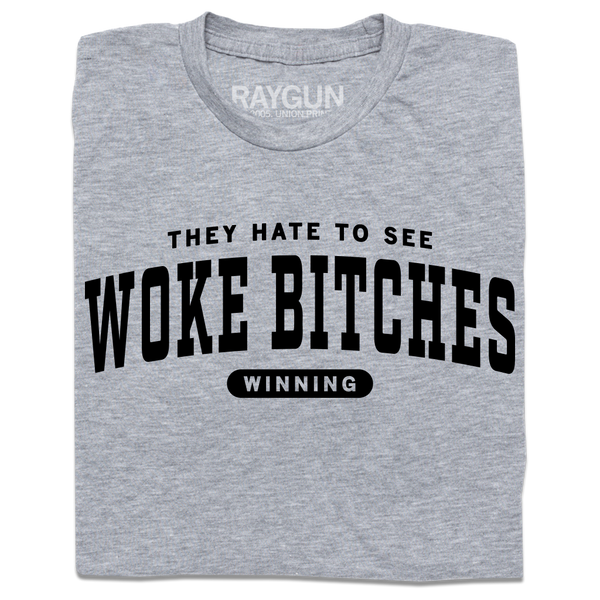 A folded heather grey t-shirt with black ink text that reads 