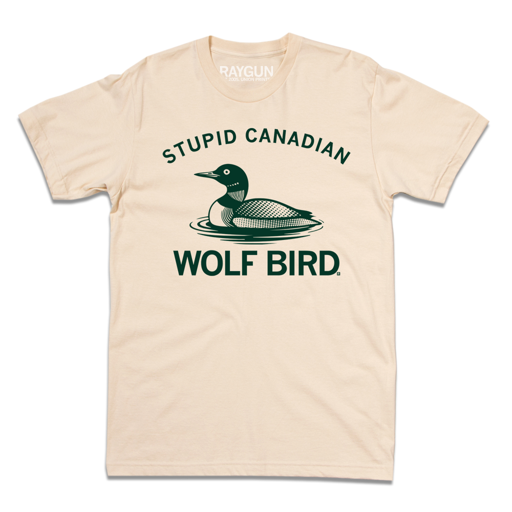 An off-white shirt with dark green ink text that reads "Stupid Canadian Wolf Bird" with in illustration of a Common Loon