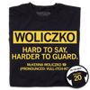 Black shirt with gold text that says, "Woliczko: Hard to say, harder to guard" over "McKenna Woliczko (Pronounced: Vull-itch-ko)"