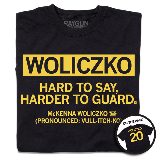 Black shirt with gold text that says, "Woliczko: Hard to say, harder to guard" over "McKenna Woliczko (Pronounced: Vull-itch-ko)"