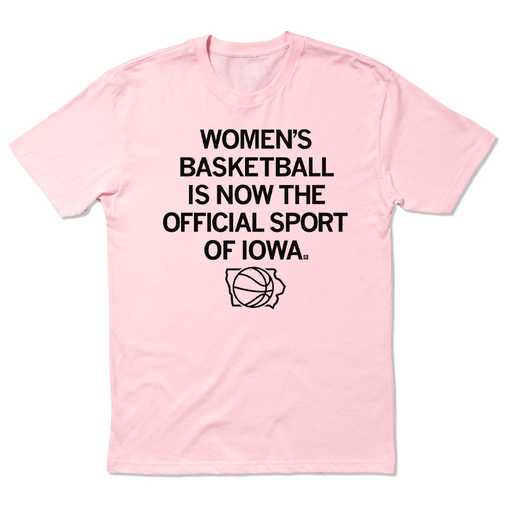 Light pink women’s basketball t-shirt featuring black text reading Womens Basketball is now the official sport of Iowa above an icon of a basketball inside the outline of the state of Iowa.