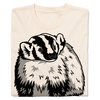 A cream-colored natural t-shirt featuring a black and white graphic of a badger.